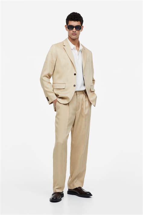 H&M Relaxed Fit Lyocell Suit logo
