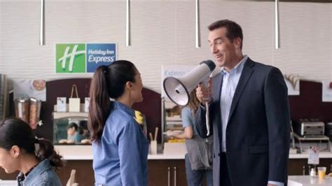 Holiday Inn Express TV Spot, 'Bullhorn' Featuring Rob Riggle featuring Steffinnie Phrommany