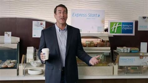 Holiday Inn Express TV Spot, 'Deals Over Bacon' Featuring Rob Riggle featuring Rob Riggle